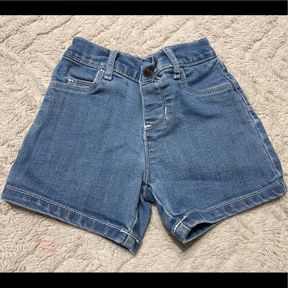 Carters 12 month denim shorts with snap button closure.